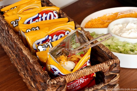 Throw taco toppings in a bag of Fritos for taco salad